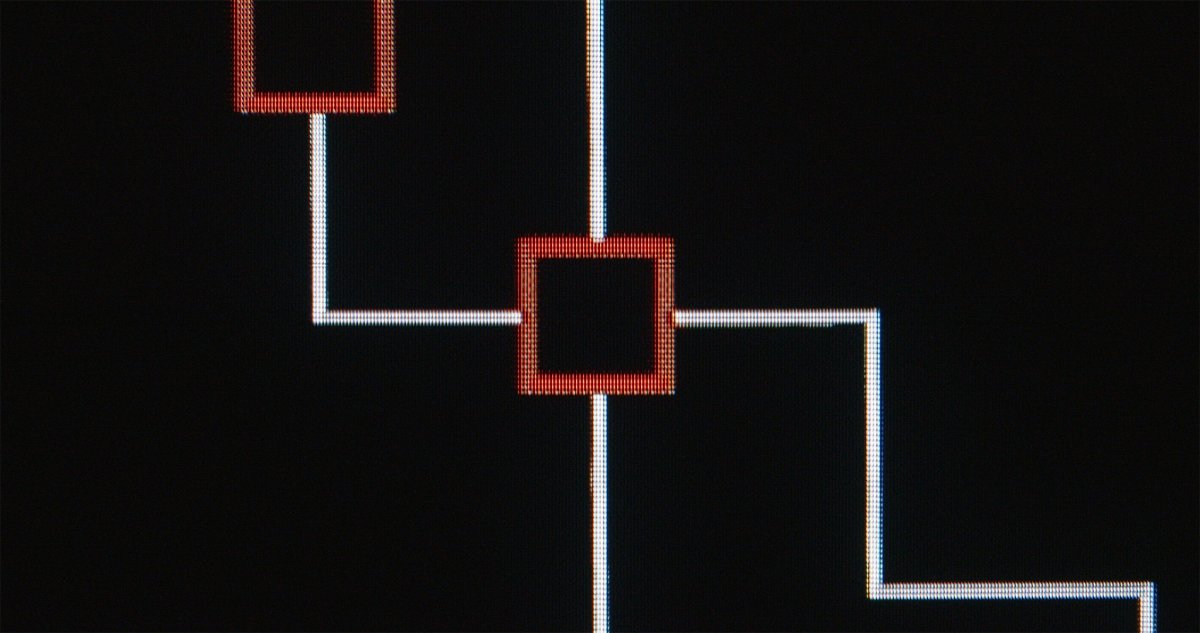 Abstract circuit-diagram graphic in red and white lines on a black background